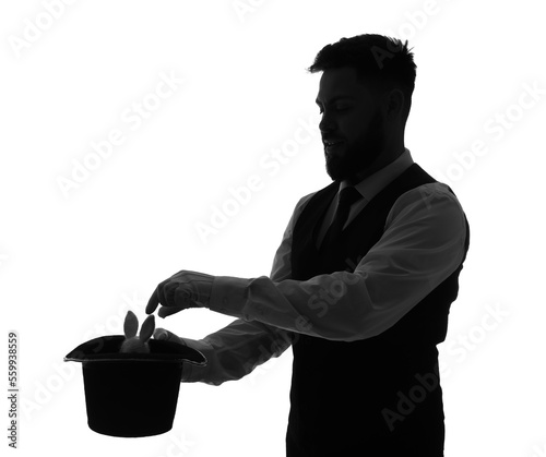 Silhouette of male magician...
