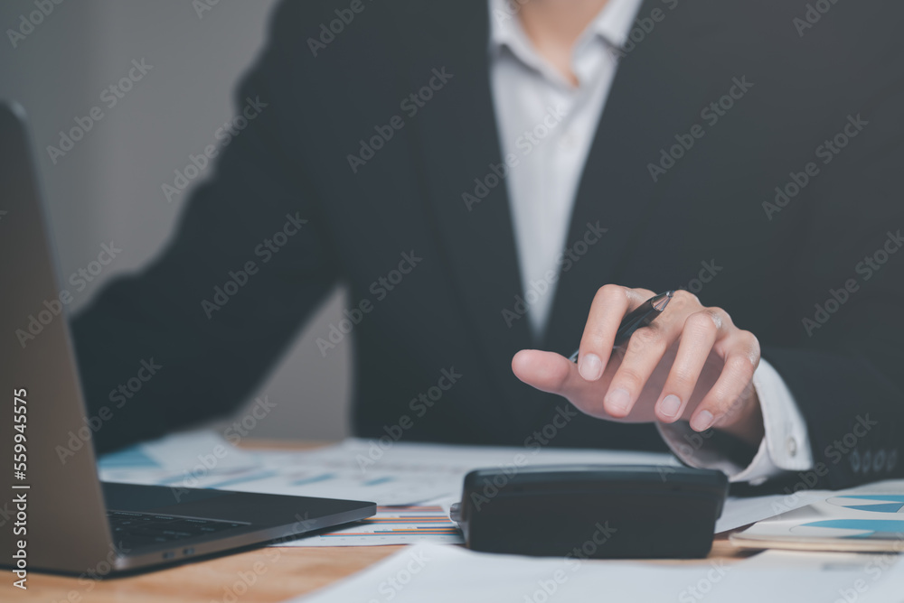 Businessman calculating figures in company financial documents with a calculator,analysis of company financial data,Planning to assess and review budgets,concept of finance and investment Businessman calculating figures in company financial documents with a calculator,analysis of company financial data,Planning to assess and review budgets,concept of finance and investment