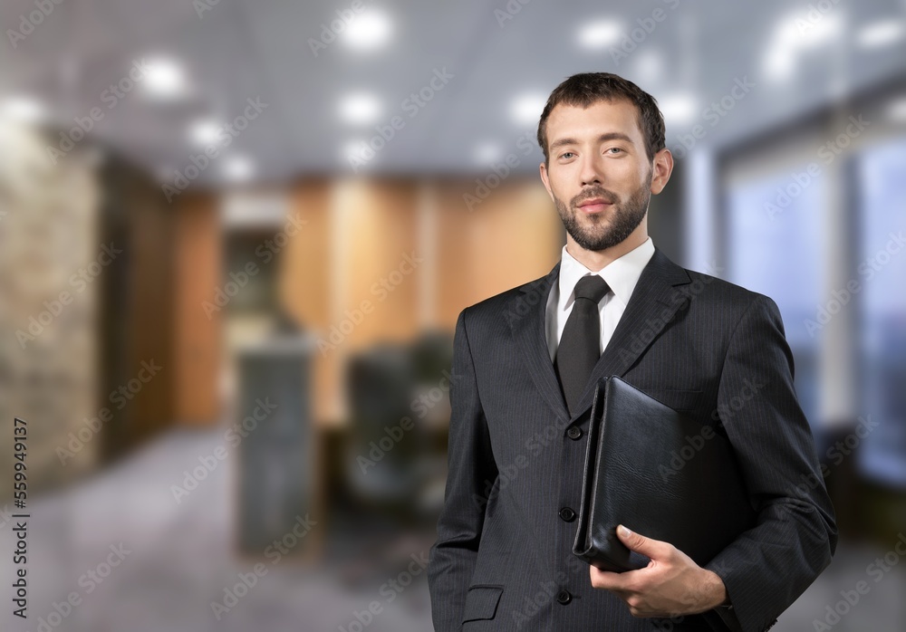 Smiling young business man employer in office Smiling young business man employer in office