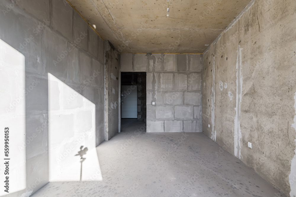 Empty concrete commercial space without finishing with partitions Empty concrete commercial space without finishing with partitions