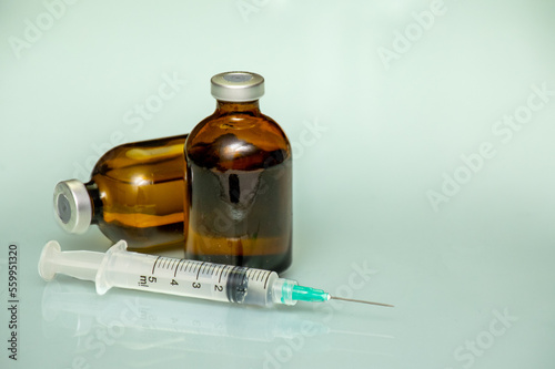 Syringe with two vials white background
