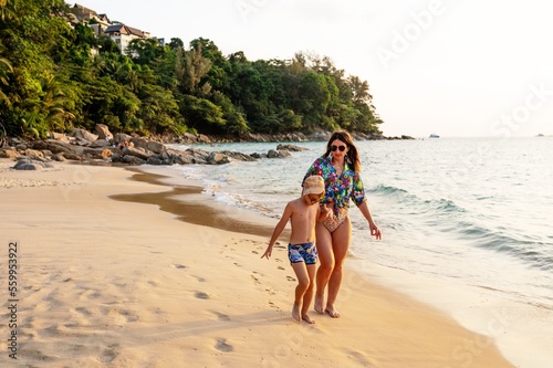 Obraz na płótnie Children and adult women walking on the Nai Thon beach in Phuket w salonie