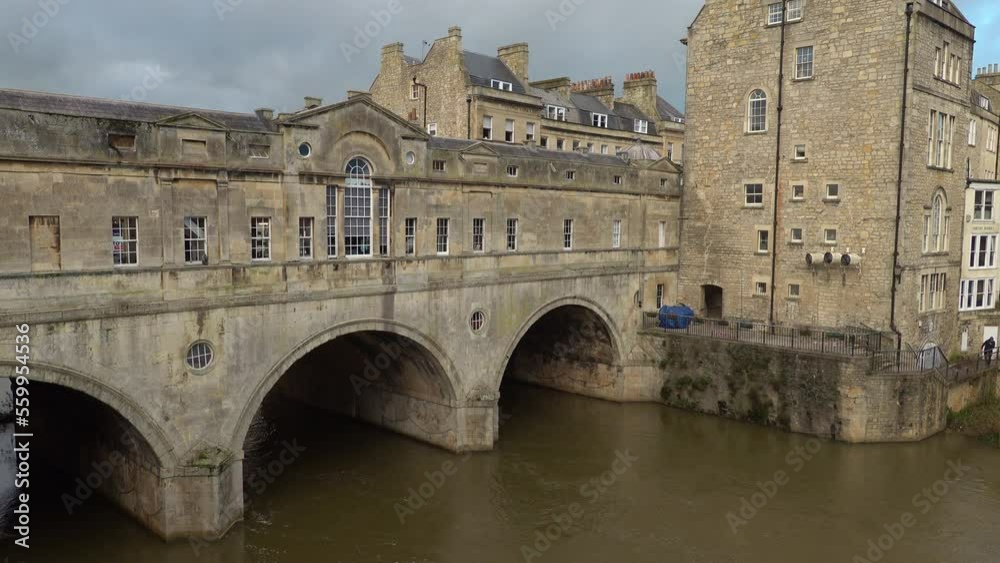 The Pulteney Bridge in Bath, UK. A bridge with shops either side. Winter The Pulteney Bridge in Bath, UK. A bridge with shops either side. Winter