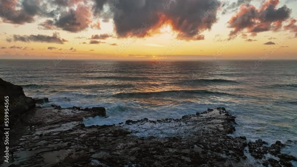 Surfs up sunrise at the seaside with scattered clouds at North Avoca, Central Coast, NSW, Australia. Surfs up sunrise at the seaside with scattered clouds at North Avoca, Central Coast, NSW, Australia.