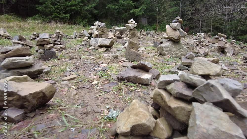 A forest path in the mountains of Ukraine. High mountain lake Synevyr. Stone glade, stones for meditation. Stone graves. A forest path in the mountains of Ukraine. High mountain lake Synevyr. Stone glade, stones for meditation. Stone graves.