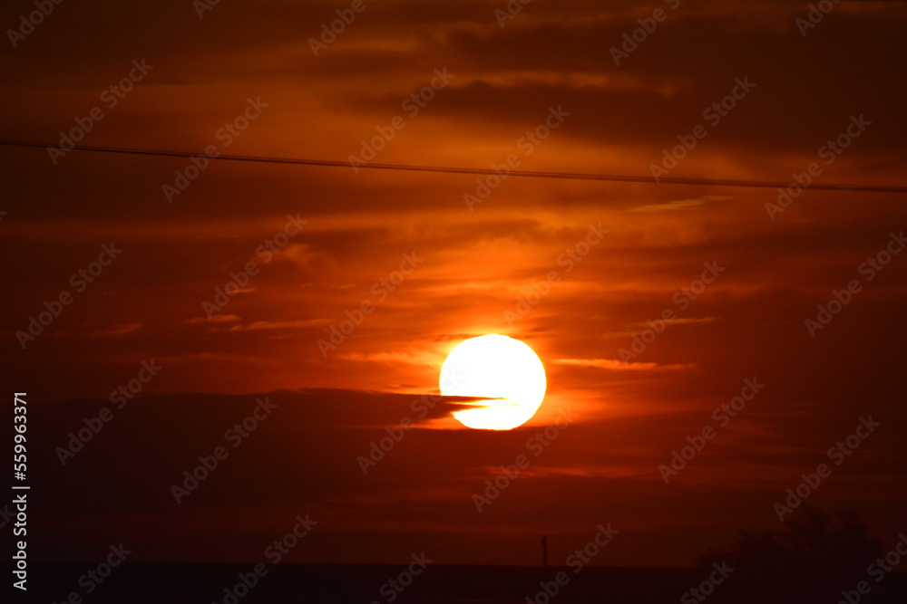 Setting sun against a dim background