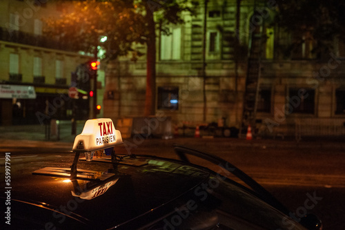 Taxi cab light at night in Paris