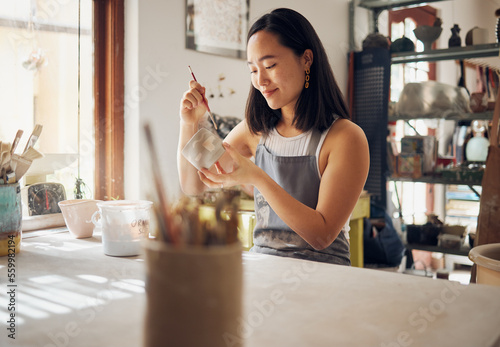 Fotografie Pottery, art and creative with an asian woman in a studio for design or ceramics hobby as an artisan