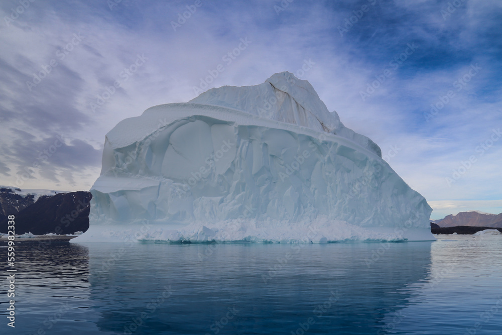 Close up of Iceberg floating in the cold waters of the Arctic circle.