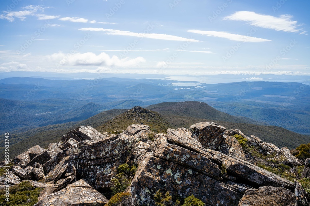 hiking up to the summit of a rocky mountain in australia