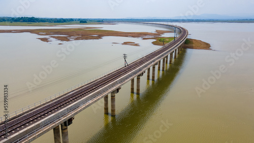 Aerial view of floating railway bridge over the water reservoir at Pasak Chonlasit Dam or Pa Sak Jolasid Dam in Lopburi province, Thailand. photo
