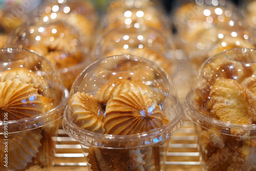 Small cookies individually wrapped in clear plastic cups © hyungmin