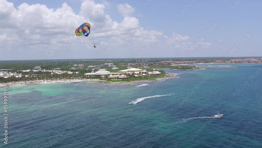 DRONE SHOOT OF BEACH PARACHUTE OVER BLUE SEA AT RIVIERA MAYA DRONE SHOOT OF BEACH PARACHUTE OVER BLUE SEA AT RIVIERA MAYA