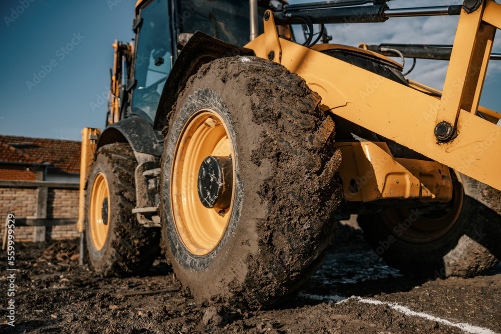 Close up of a backhoe tire on construction site. Close up of a backhoe tire on construction site.