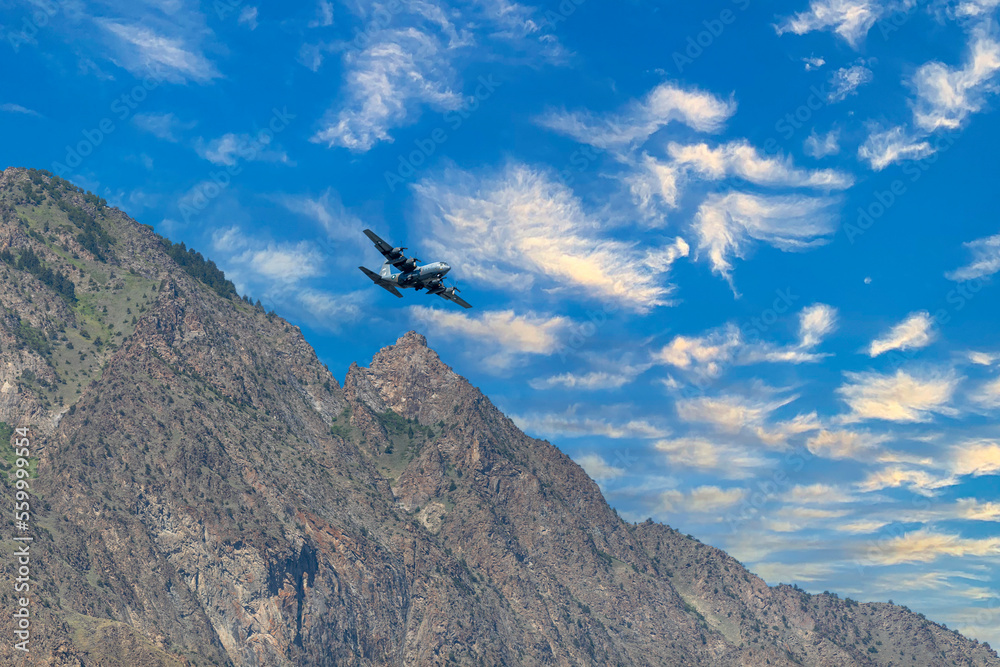 Cargo aeroplane flying over the mountains Cargo aeroplane flying over the mountains