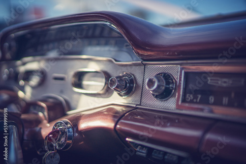 Close up of 1955 Chevrolet interior dashboard with radio knobs and dials. 
