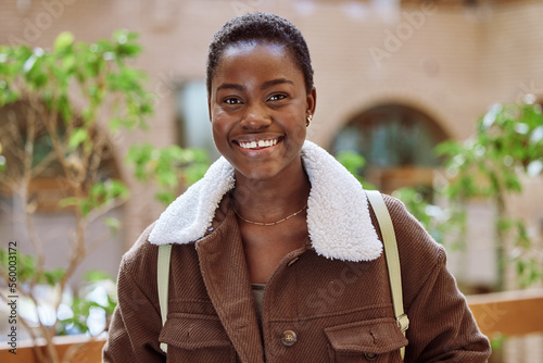 Happy, portrait and black woman student at college standing in an outdoor garden in South Africa. Happiness, excited and African female with positive mindset at university with education scholarship.