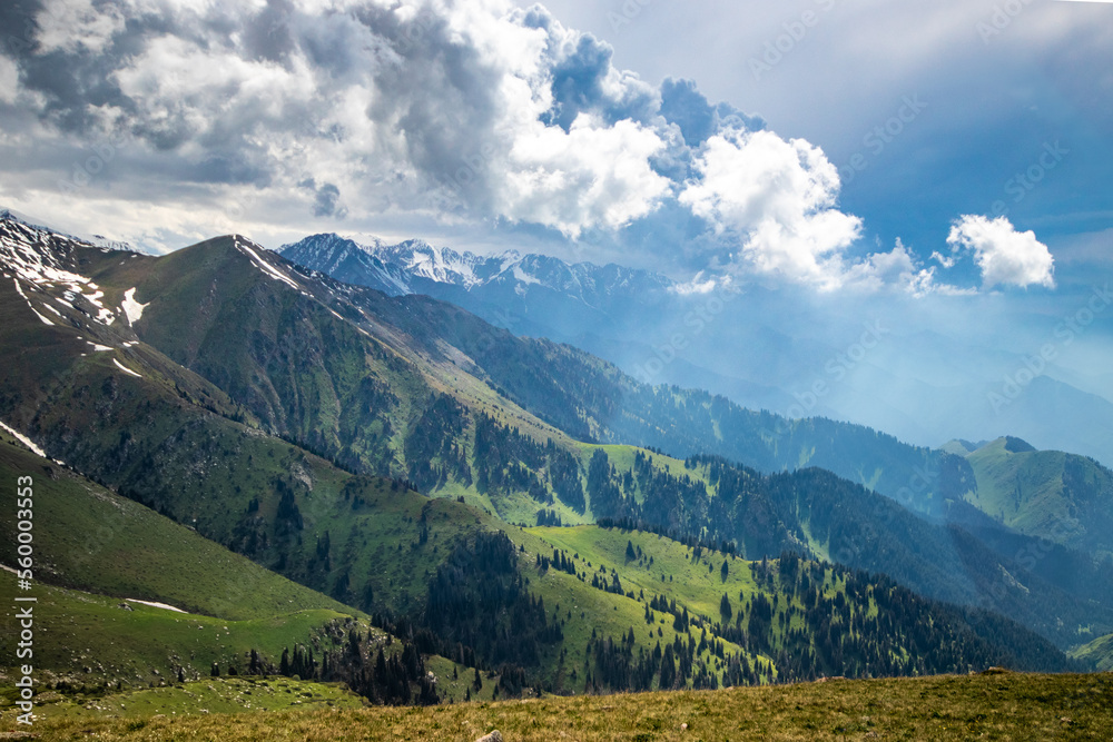 Amazing view landscape of summer in Almaty cloudy mountains in the Ile Alatau National Park.