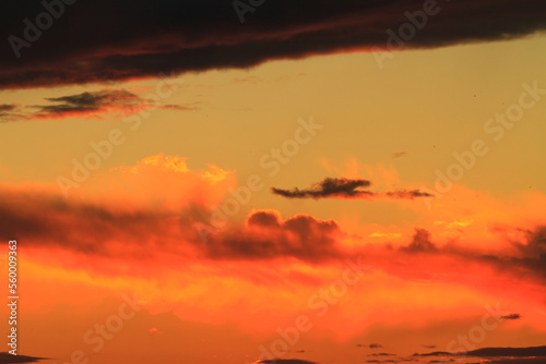Sunset or dawn colorful sky with clouds. Wallpaper of an evening or morning sky