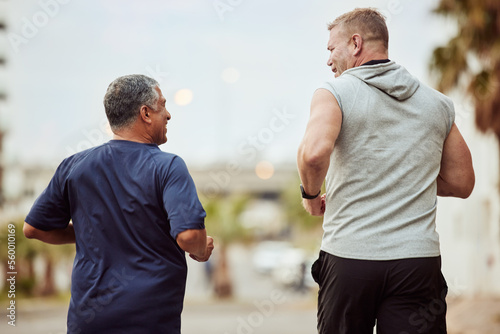 Back view, friends and fitness men in city, healthy lifestyle and outdoor performance. Senior males, running exercise and urban marathon training in neighborhood street for energy, power and sports © S Fanti/peopleimages.com