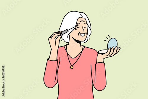 Smiling elderly woman look in mirror doing makeup. Happy optimistic mature grandmother do beauty procedures at home. Vector illustration. 