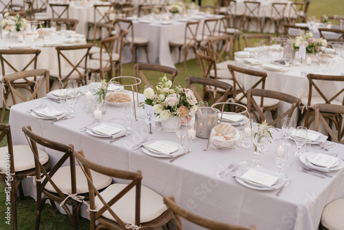 outdoor event, white chairs and tables placed outside © Rafik