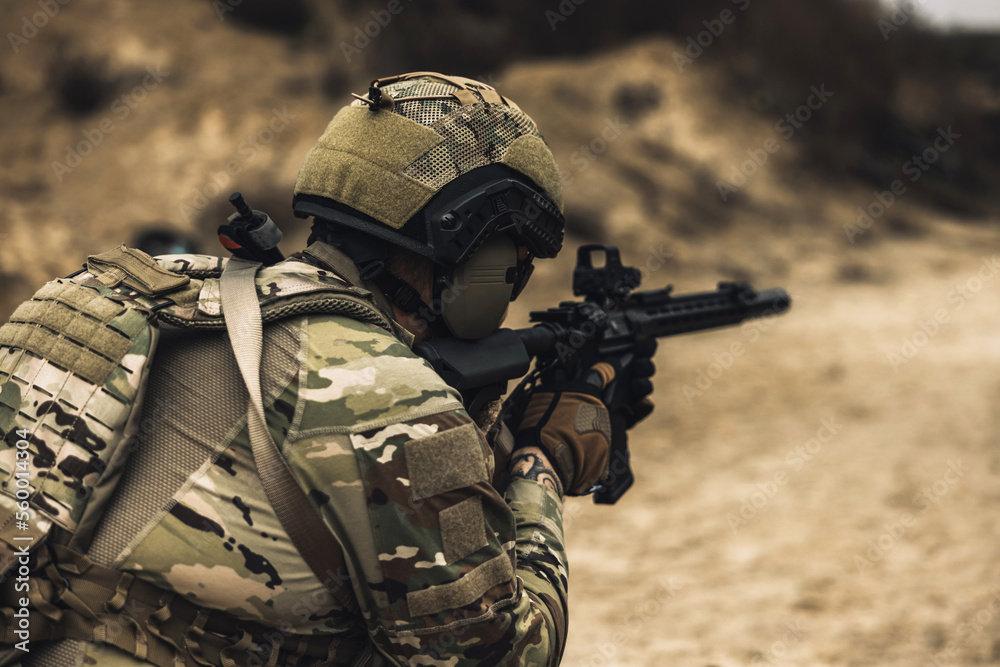 Fototapeta premium Sniper with rifle on a position