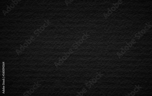 Art black concrete stone texture for background in black. Cement and sand grey dark detail covering.	