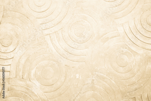 Cream concrete texture wall background. Abstract beige paint floor stamped concrete surface clean polished on walkway in garden. Wallpaper pattern curved circle rough brown cement stone decorative.