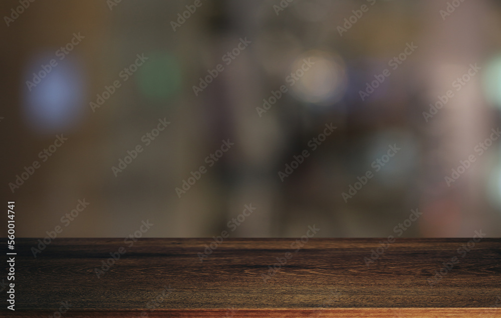 Wood table top in front of abstract blurred background. Empty wooden table space for text marketing promotion. blank wood table surface copy space