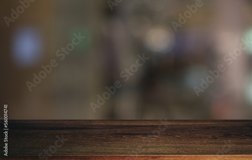 Wood table top in front of abstract blurred background. Empty wooden table space for text marketing promotion. blank wood table surface copy space