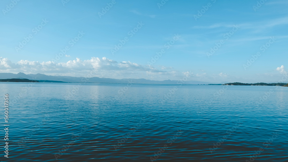 Full frame shot of lake, clouds and blue sky, backgrounds
