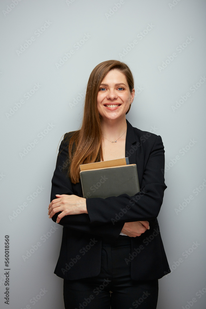 Happy school teacher woman holding books or workbooks Happy school teacher woman holding books or workbooks