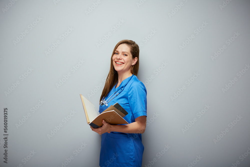Smiling medical student with book. Isolated portrait of female medical worker. Smiling medical student with book. Isolated portrait of female medical worker.