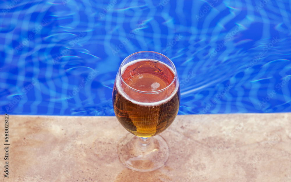 glass with fresh cold beer on pool edge blue color water waves mockup ...