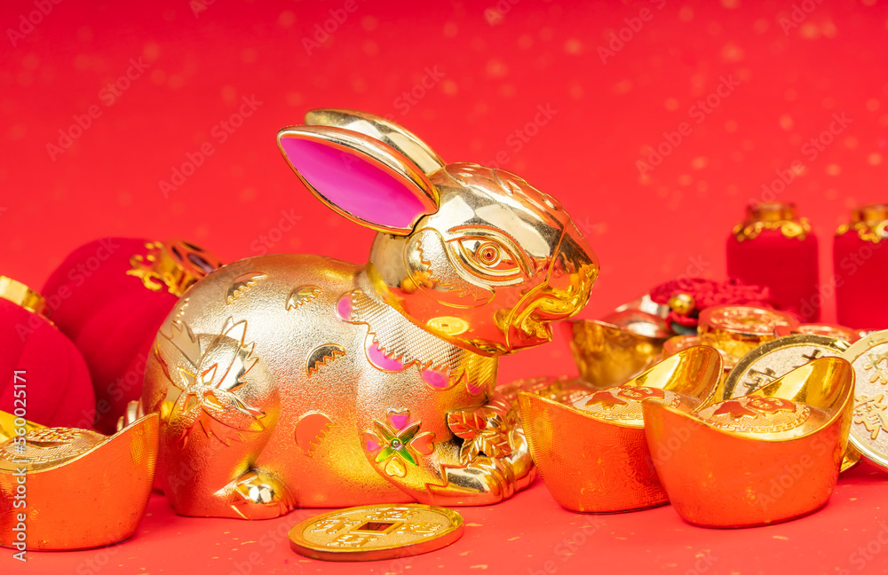 Tradition Chinese golden rabbit statue,2023 is year of the rabbit,Chinese characters on coin translation: good bless for new year. - obrazy, fototapety, plakaty 
