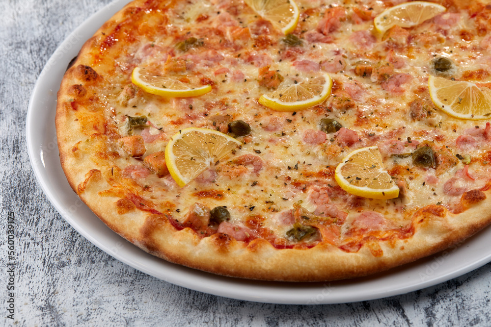 fresh pizza on the white plate fresh pizza on the white plate