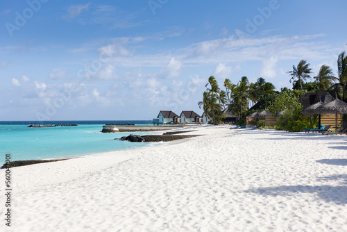 Photography Beach of a tropical island with white sand and turquoise water on the maledives