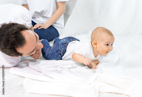 the child crawls on the floor. White background © Ольга Новицкая
