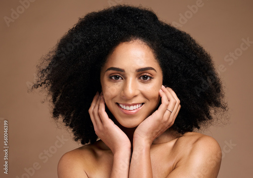 Black woman, studio portrait and skincare for beauty, makeup and cosmetic health with hands, face or natural hair. Model, smile and facial skin cosmetics, self care or afro by brown studio background