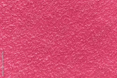 Viva Magenta pink plaster wall background.