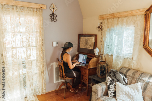 Young woman works from remote cabin in upstate New York