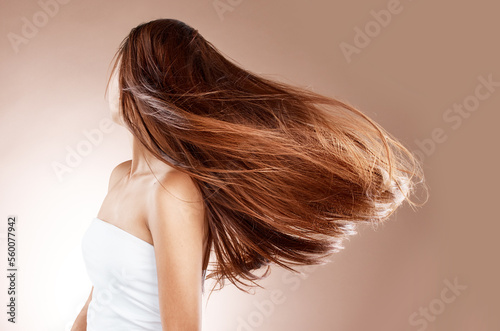Konstfotografi Beauty, hairstyle and hair care of woman in studio on a brown background
