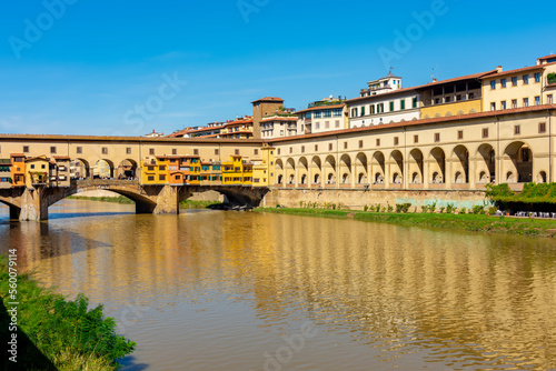 Ponte Vecchio bridge and Vasari corridor over Arno river in Florence, Italy photo