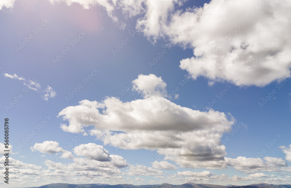 Fototapeta premium blue sky with clouds over mountain range