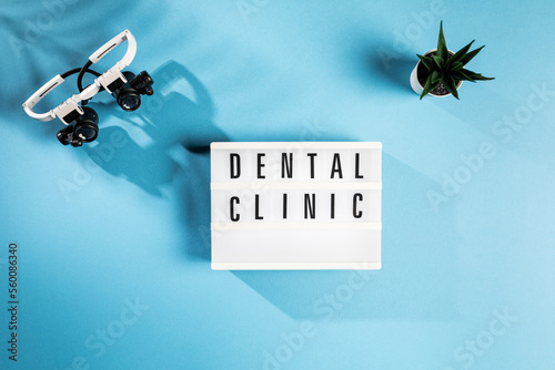 Dental Clinic sign on Blue Background photo