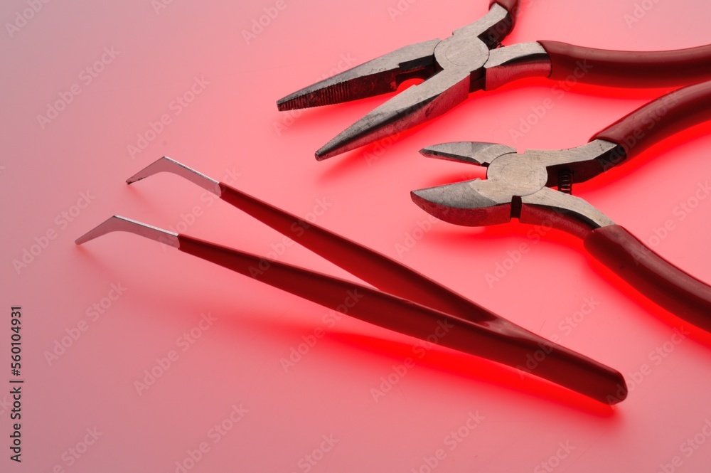 Tool for working with electricians wire cutters and pliers. Full color background. Close-up. Tool for working with electricians wire cutters and pliers. Full color background. Close-up.