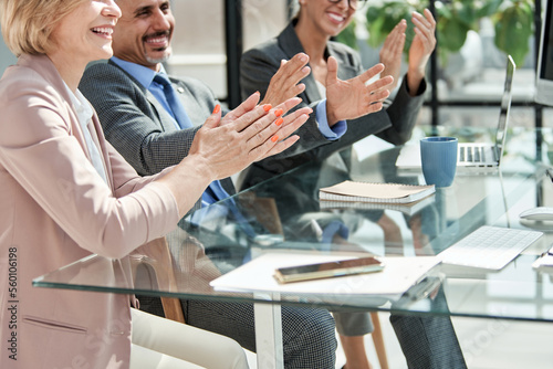 business colleagues applauding at a business presentation.