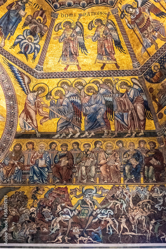 Mosaic composing religious mural inside catholic church in Florence showing scenes of heaven and hell