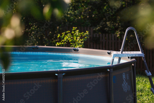 Swimming pool with metal frame for home and garden Fototapet